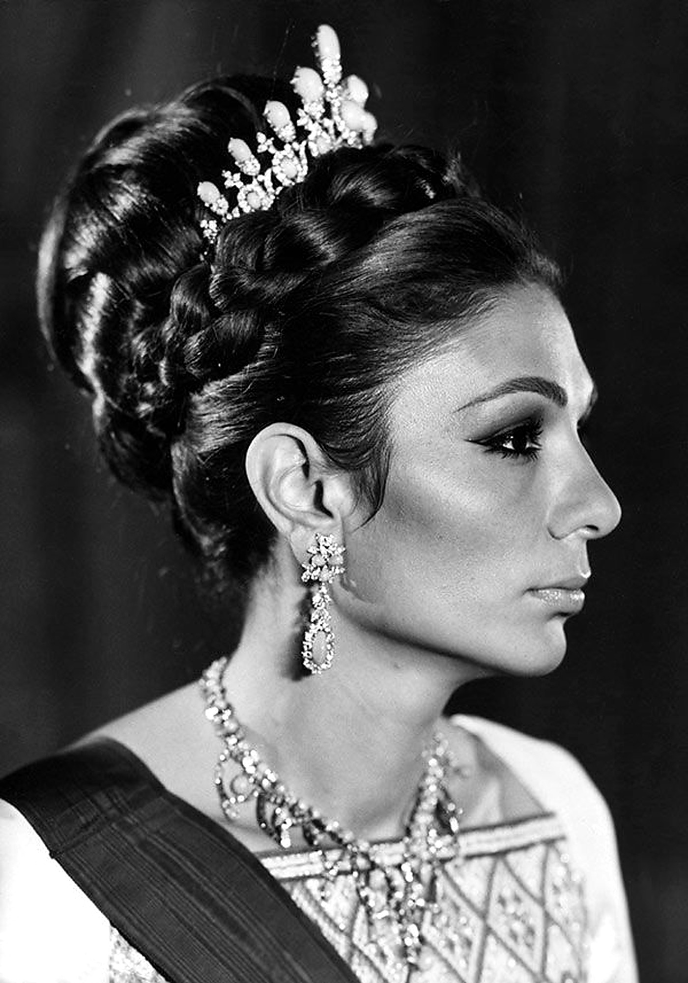 Farah Pahlavi in profile with diamond tiara.