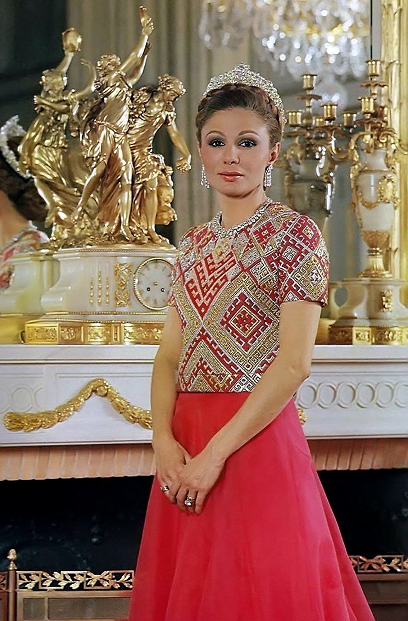 Farah Pahlavi in red-and-gold geometric couture.
