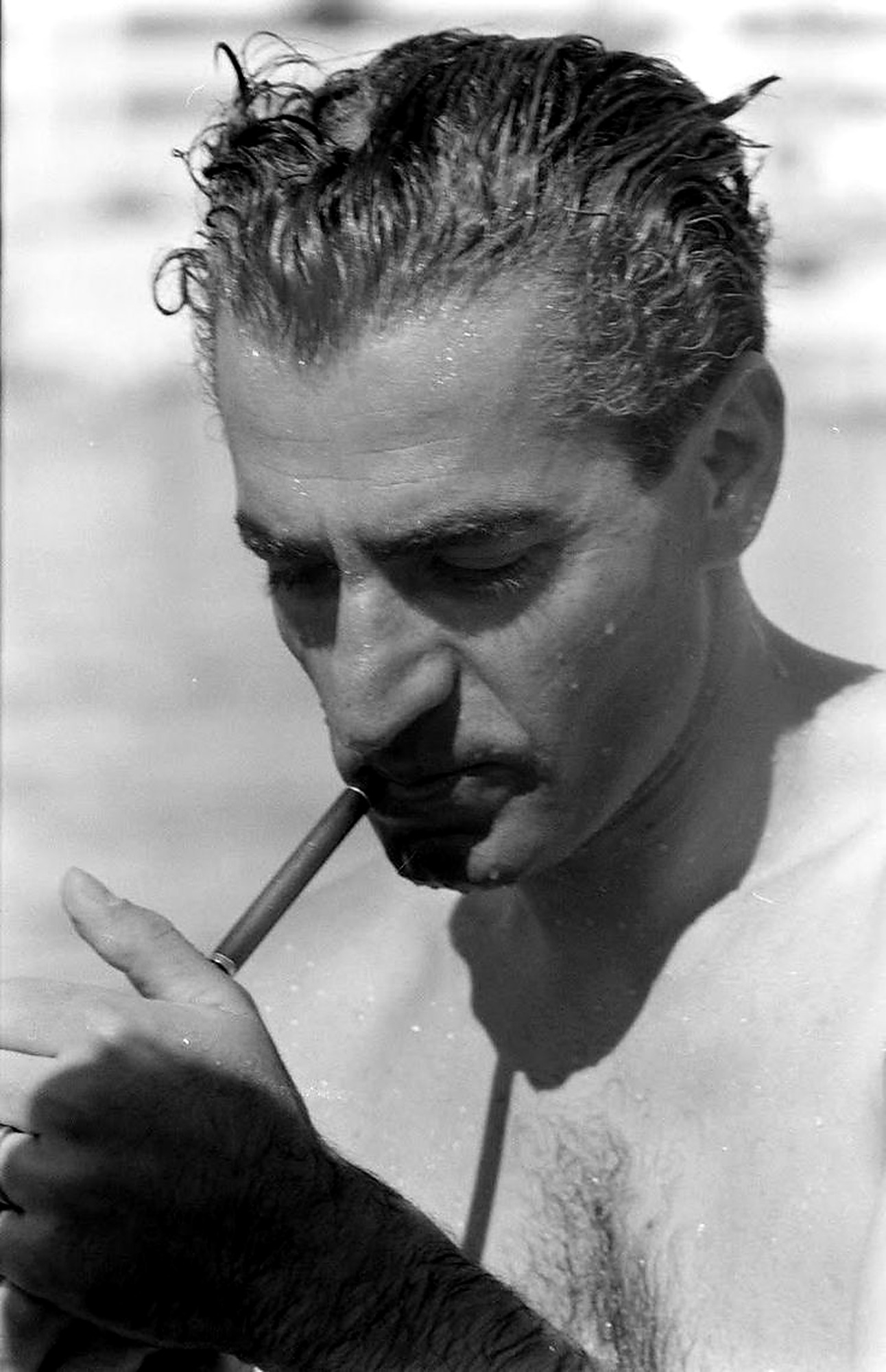 Beach, pipe, wet hair.