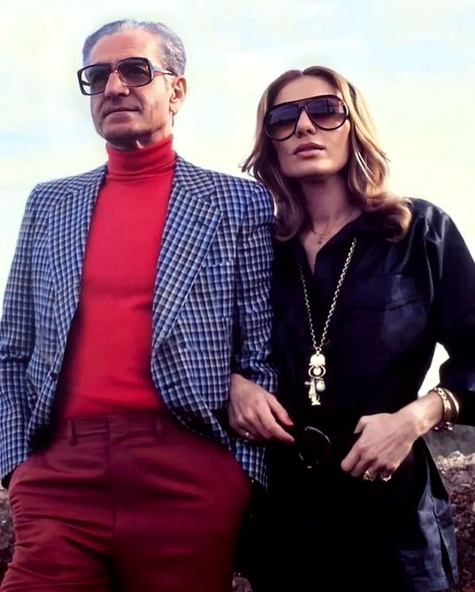 Casual seventies — sunglasses and red turtleneck.