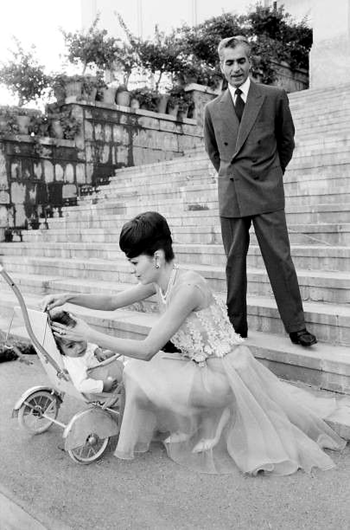 Farah with the pram on palace steps.