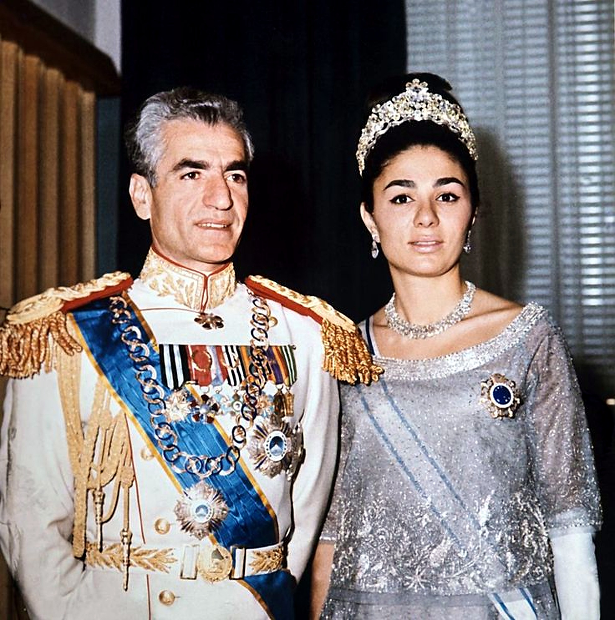 The Shah and Farah in white and silver formal dress.